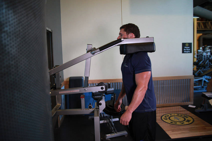 How to perform the Calf-Machine Shoulder Shrug exercise