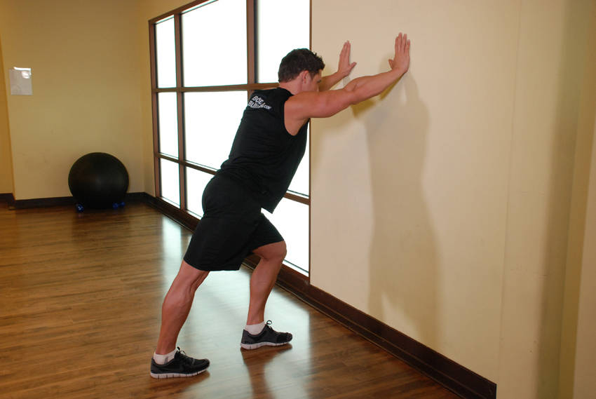 How to perform the Calf Stretch Hands Against Wall exercise