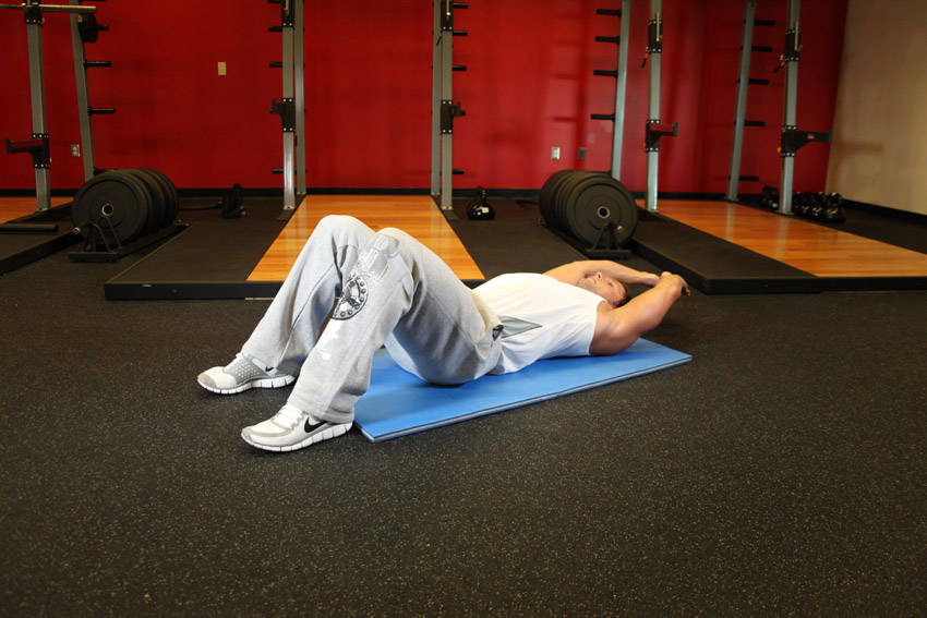 How to perform the Crunch - Hands Overhead exercise
