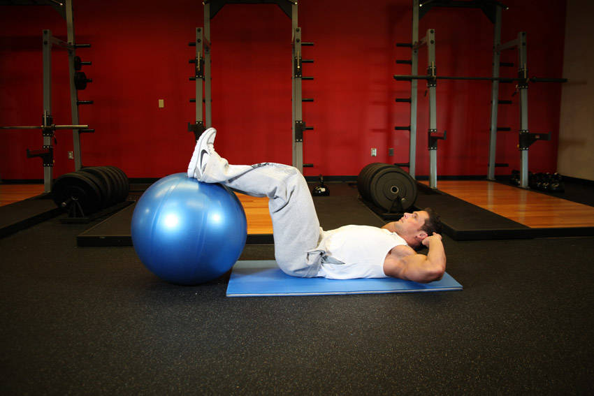 How to perform the Crunch - Legs On Exercise Ball exercise