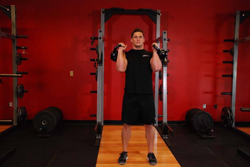 How to perform the Alternating Kettlebell Press exercise