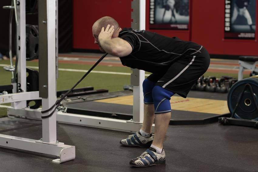 How to perform the Band Good Morning (Pull Through) exercise