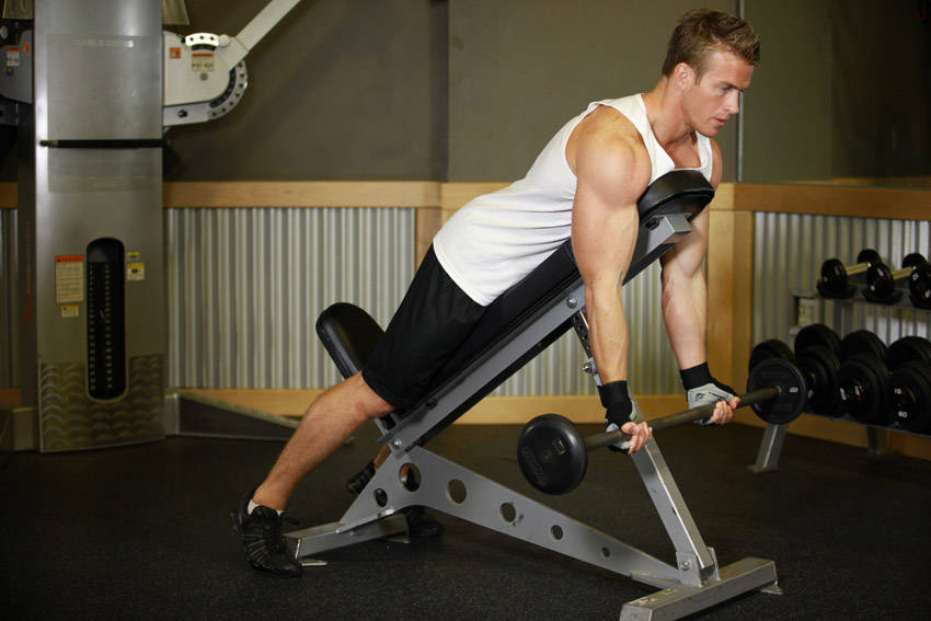 How to perform the Barbell Curls Lying Against An Incline exercise