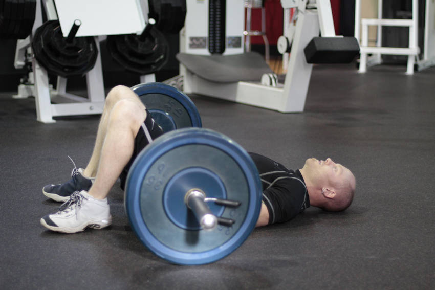 How to perform the Barbell Glute Bridge exercise