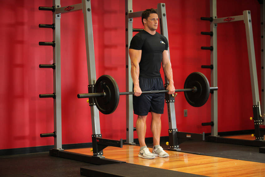 How to perform the Barbell Shrug exercise