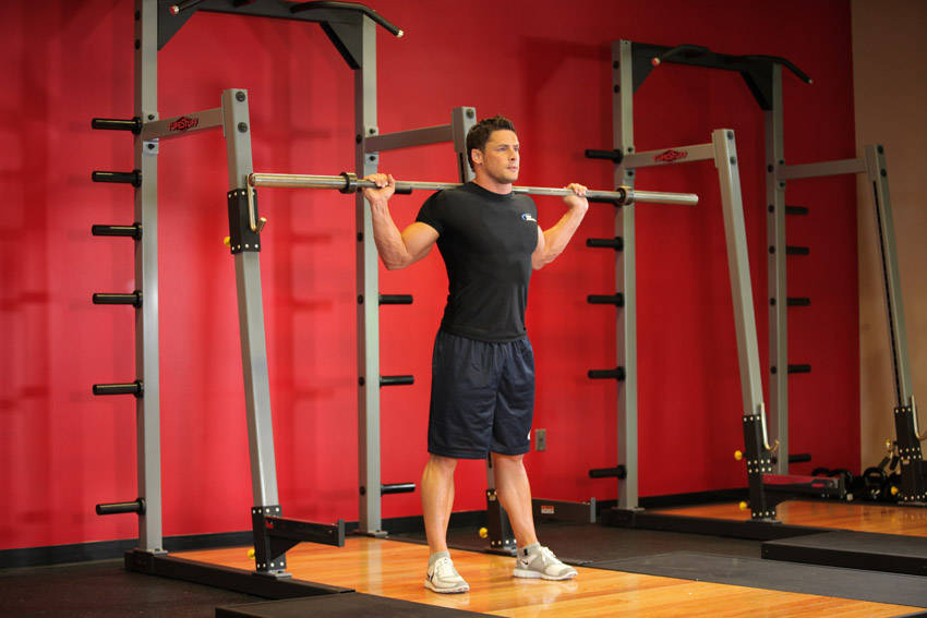 How to perform the Barbell Side Bend exercise