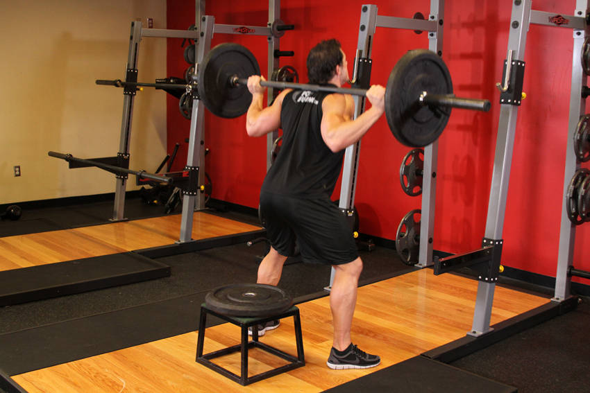 How to perform the Barbell Squat To A Bench exercise