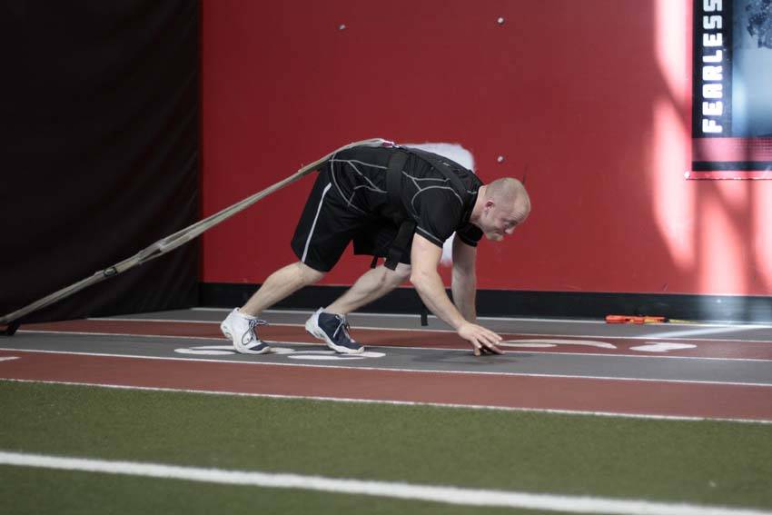 How to perform the Bear Crawl Sled Drags exercise