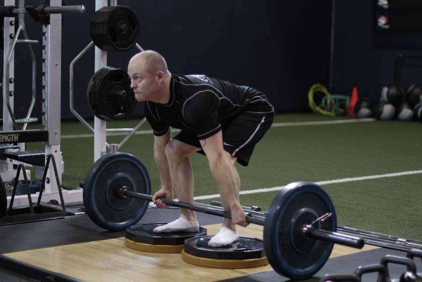 How to perform the Deficit Deadlift exercise