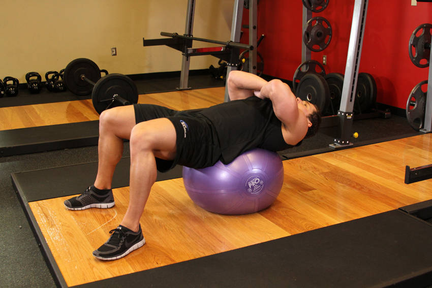 How to perform the Exercise Ball Crunch exercise
