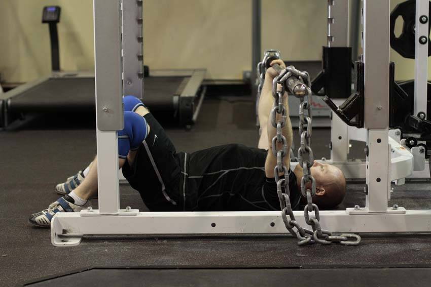 How to perform the Floor Press with Chains exercise