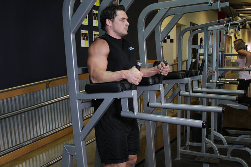 How to perform the Knee/Hip Raise On Parallel Bars exercise