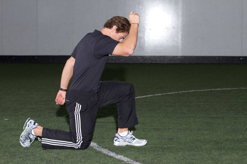 How to perform the Kneeling Arm Drill exercise