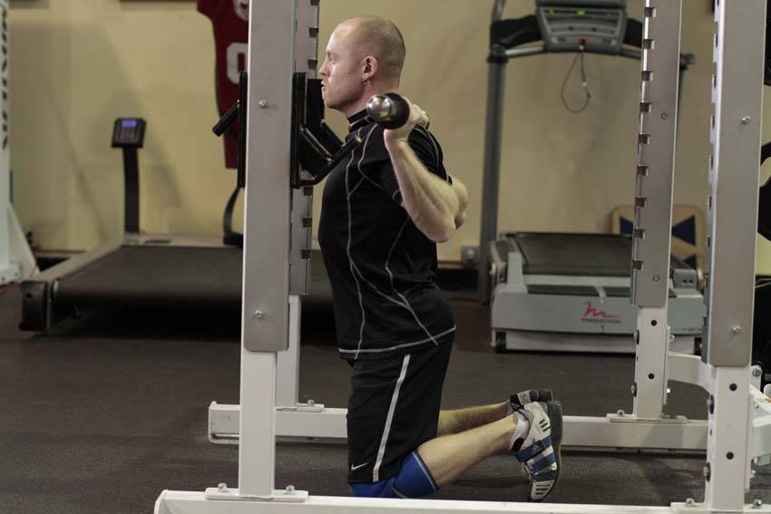 How to perform the Kneeling Squat exercise