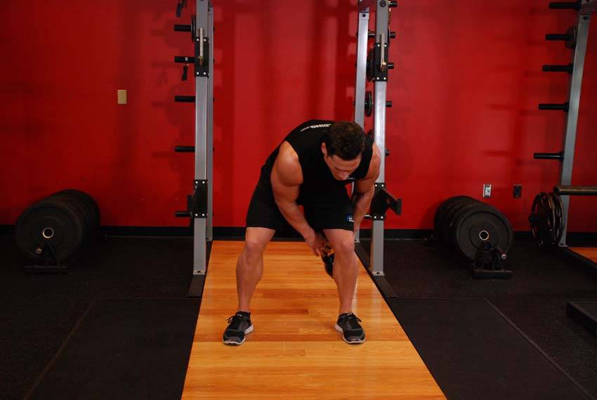 How to perform the Kettlebell Figure 8 exercise