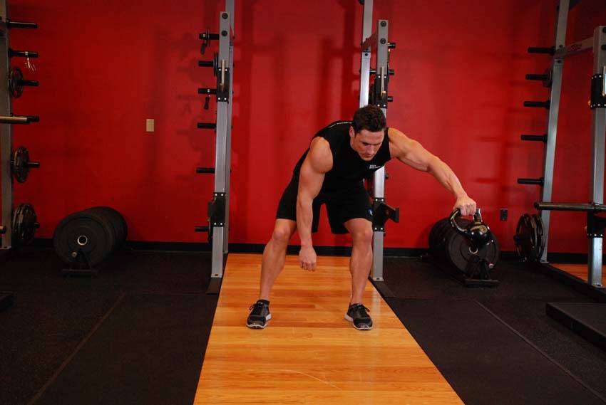 How to perform the Kettlebell Pass Between The Legs exercise