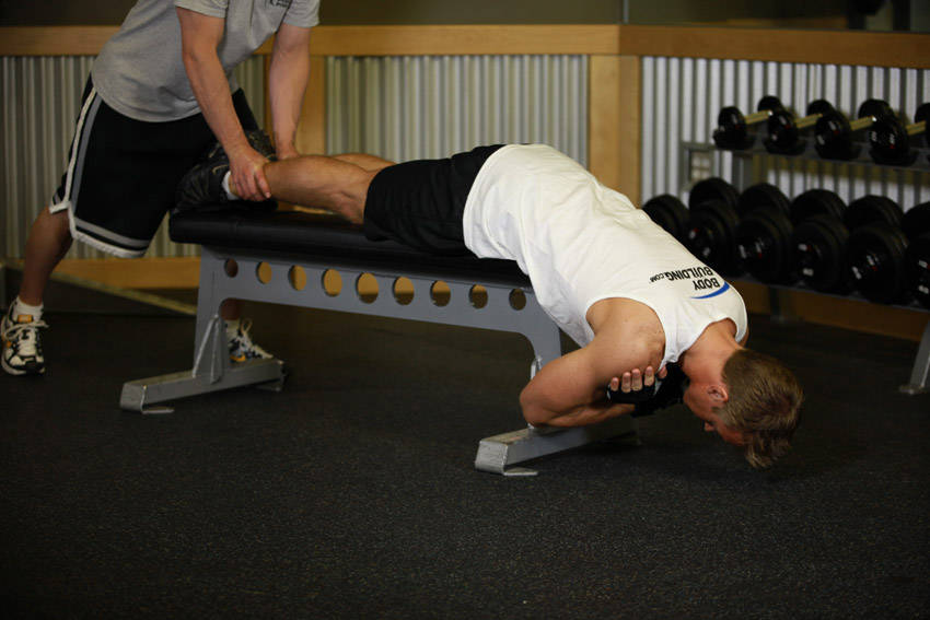 How to perform the Hyperextensions With No Hyperextension Bench exercise