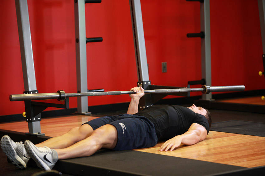 How to perform the One Arm Floor Press exercise