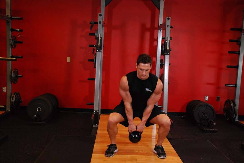 How to perform the Open Palm Kettlebell Clean exercise