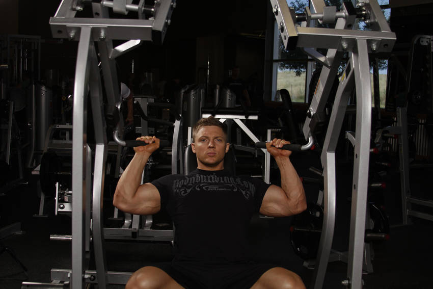 How to perform the Leverage Shoulder Press exercise