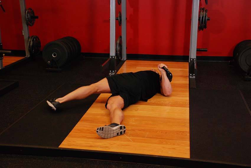 How to perform the Leg-Over Floor Press exercise