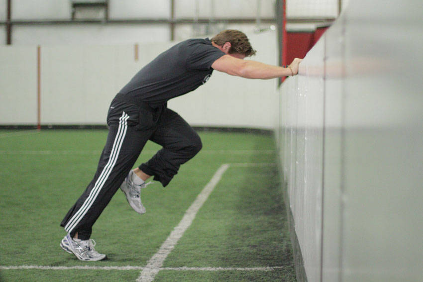 How to perform the Linear Acceleration Wall Drill exercise