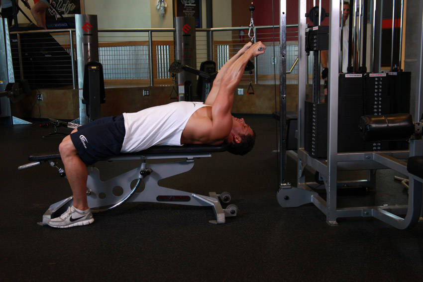 How to perform the Lying Close-Grip Bar Curl On High Pulley exercise