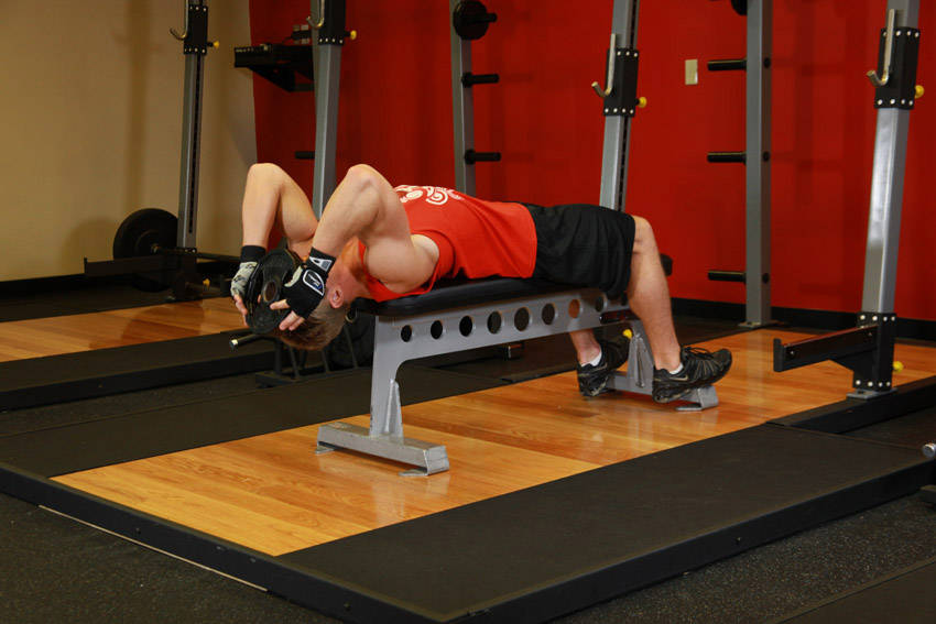 How to perform the Lying Face Up Plate Neck Resistance exercise