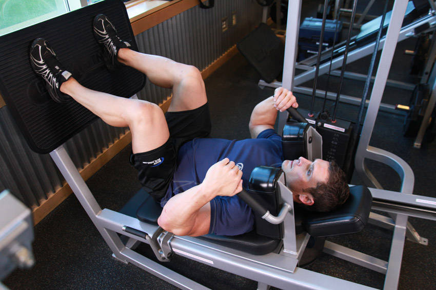 How to perform the Lying Machine Squat exercise