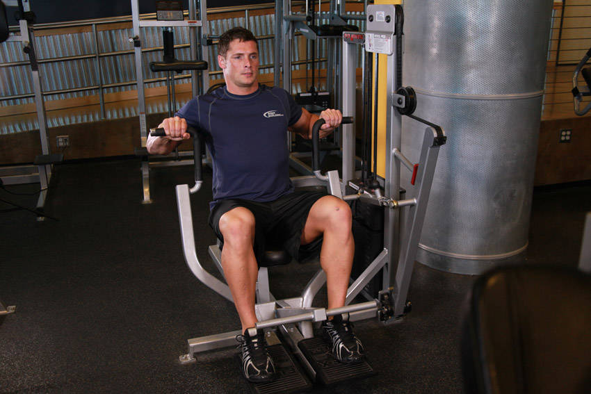 How to perform the Machine Bench Press exercise