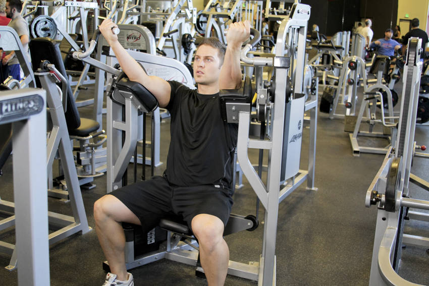 How to perform the Machine Bicep Curl exercise