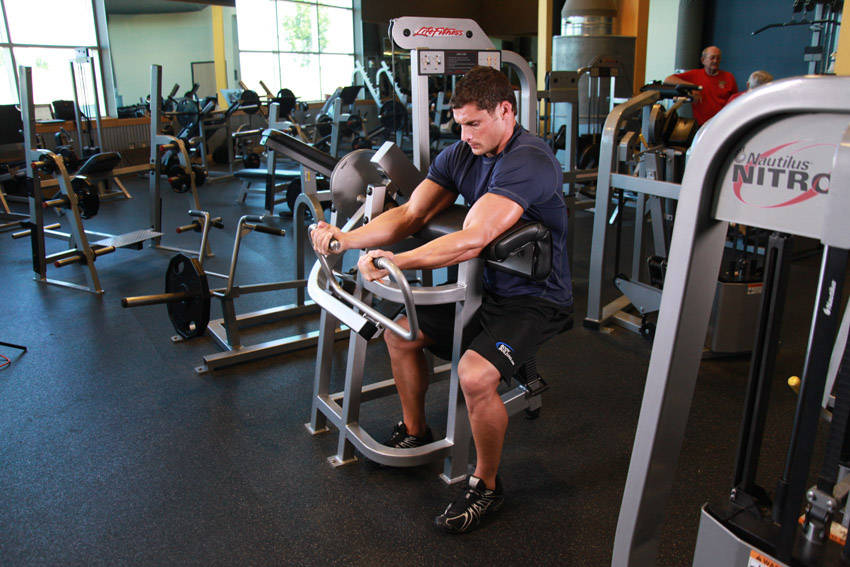 How to perform the Machine Preacher Curls exercise