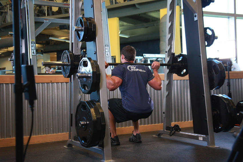 How to perform the Smith Machine Squat exercise