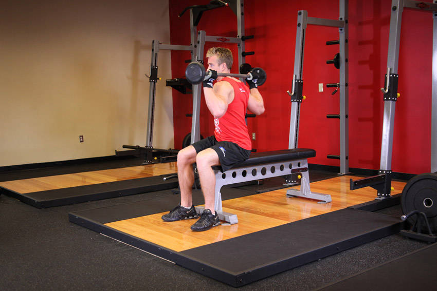 How to perform the Seated Barbell Twist exercise