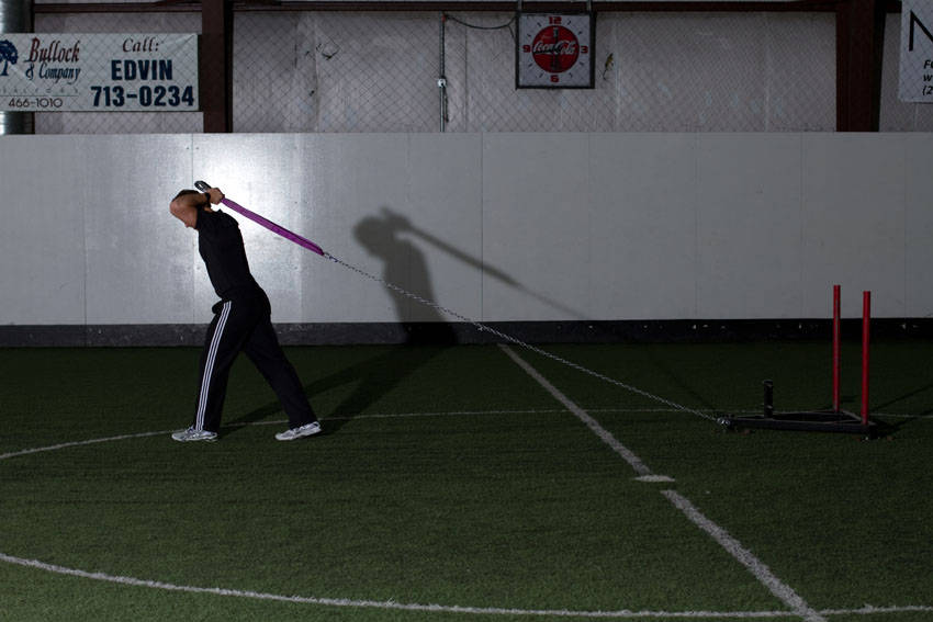 How to perform the Sled Overhead Triceps Extension exercise