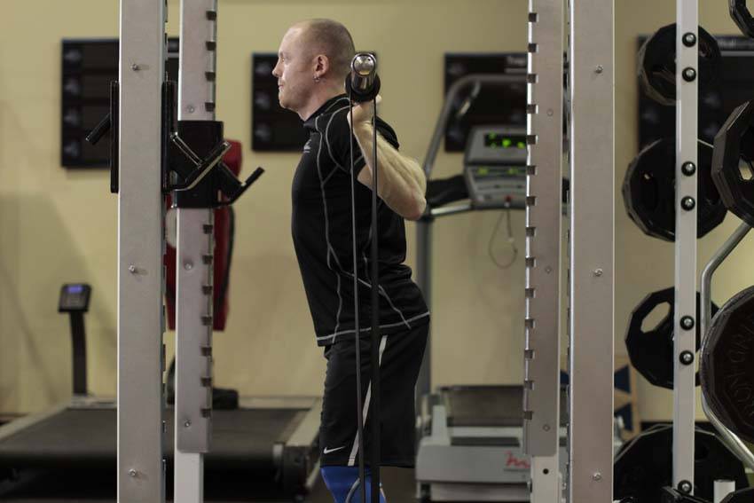 How to perform the Squat with Bands exercise