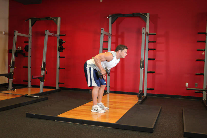 How to perform the Standing Bent-Over One-Arm Dumbbell Triceps Extension exercise