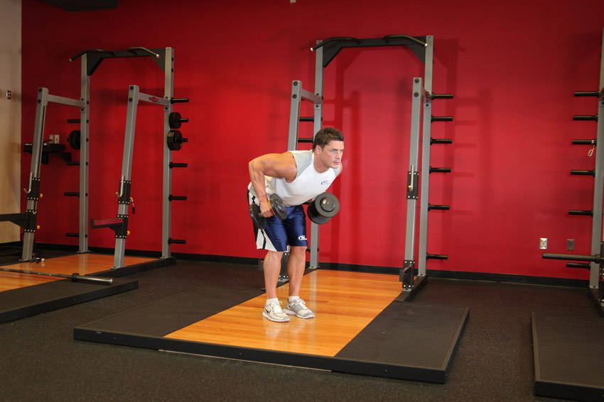 How to perform the Standing Bent-Over Two-Arm Dumbbell Triceps Extension exercise