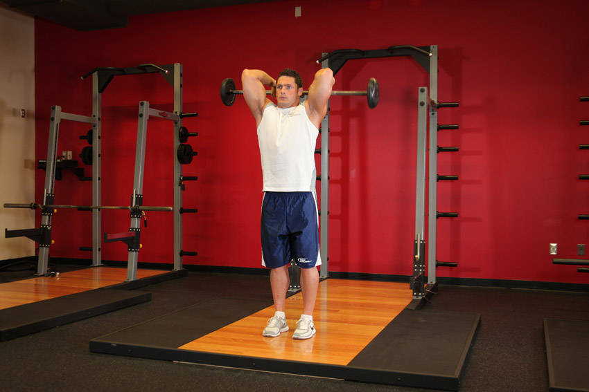 How to perform the Standing Overhead Barbell Triceps Extension exercise
