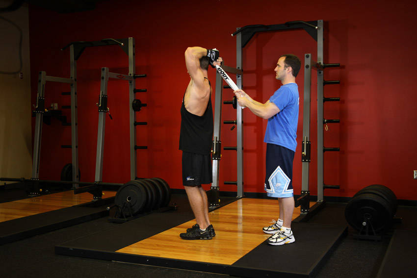 How to perform the Standing Towel Triceps Extension exercise