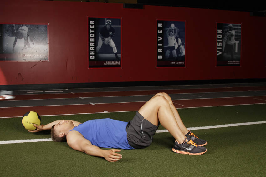 How to perform the Supine One-Arm Overhead Throw exercise