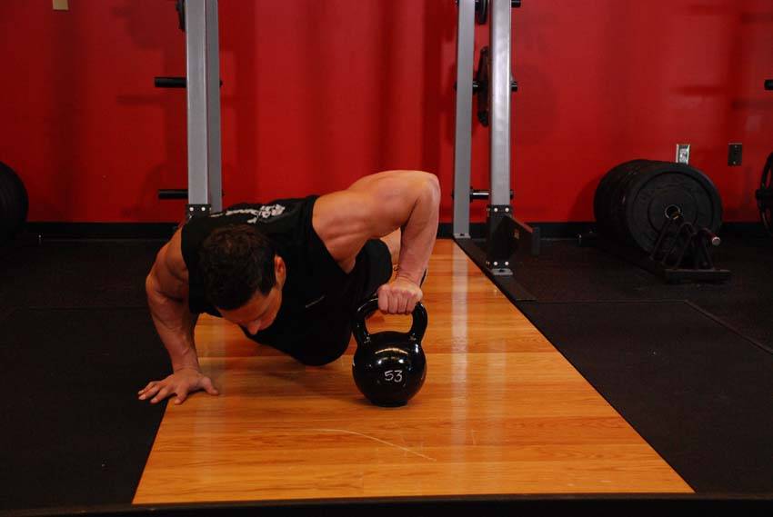 How to perform the Plyo Kettlebell Pushups exercise