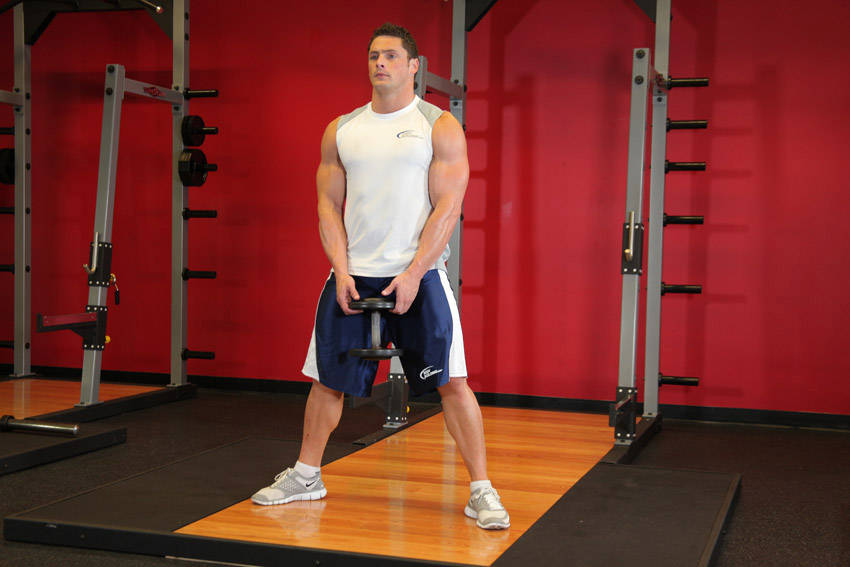 How to perform the Plie Dumbbell Squat exercise