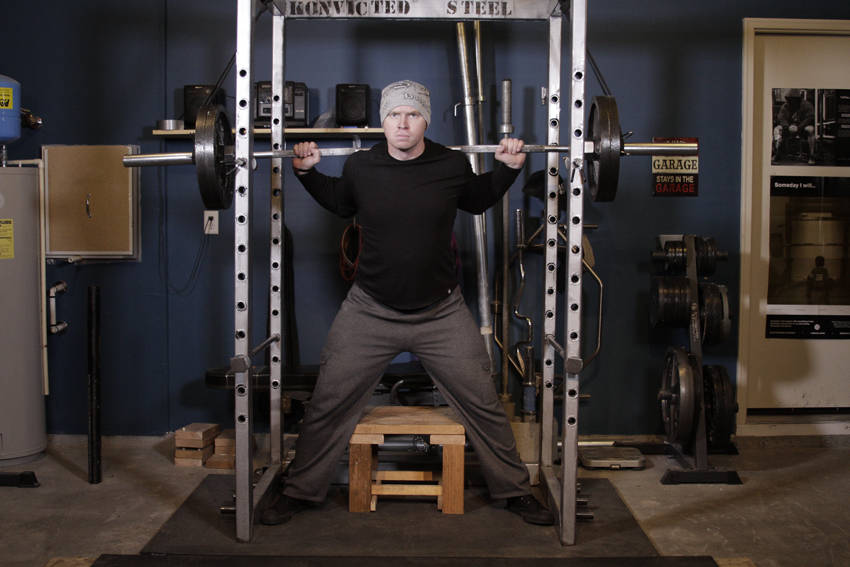 How to perform the Reverse Band Box Squat exercise