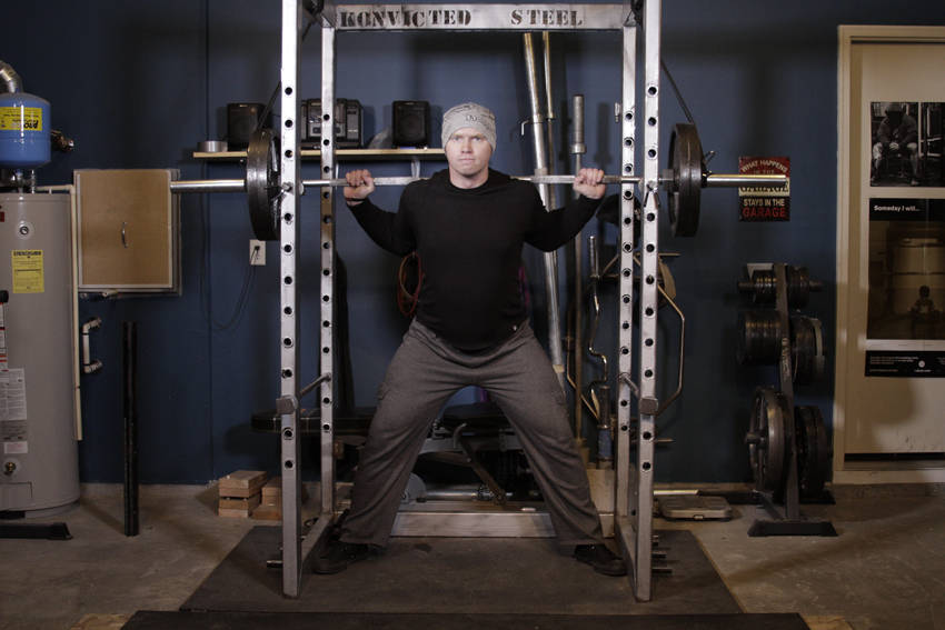 How to perform the Reverse Band Power Squat exercise