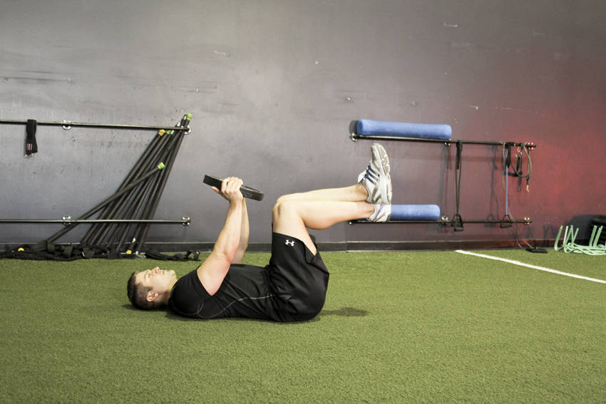 How to perform the Weighted Crunches exercise