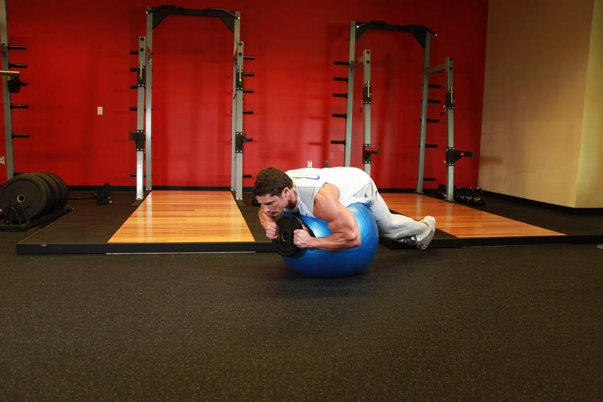 How to perform the Weighted Ball Hyperextension exercise