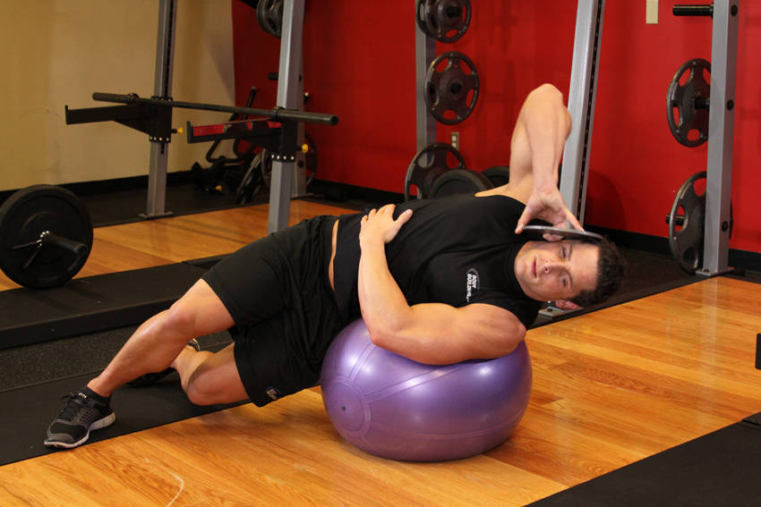 How to perform the Weighted Ball Side Bend exercise